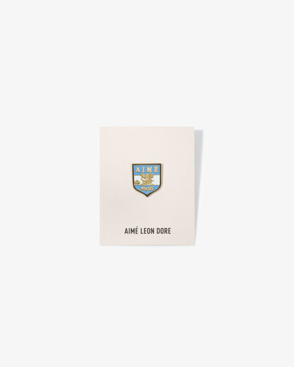 Aimé Leon Dore Top Pick - Graphic Pin Crest shield